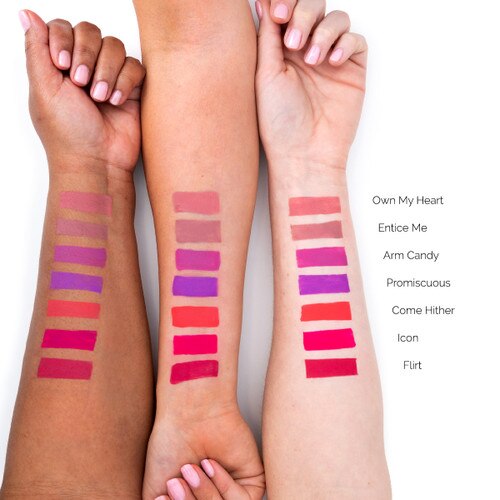 An image of three outstretched arms of differing skin tones showcasing different colors of liquid suede matte color in swatches on each arm for comparison.